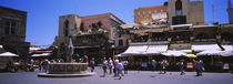 Tourists walking at a town square, Plateia Ippokratous, Rhodes, Greece by Panoramic Images