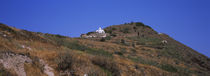 Low angle view of a chapel on a hill, on way to Oia, Santorini, Greece by Panoramic Images