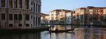 Man on a gondola in a canal, Grand Canal, Venice, Italy von Panoramic Images