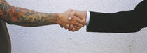 Close-Up Of Two Men Shaking Hands, Germany von Panoramic Images