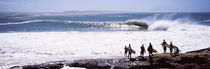 Silhouette of surfers standing on the beach, Australia by Panoramic Images