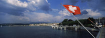 Swiss flag fluttering at the lakeside, Lake Geneva, Geneva, Switzerland by Panoramic Images