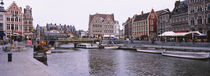 Tour boats docked at a harbor, Leie River, Graslei, Ghent, Belgium by Panoramic Images