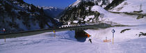 Person skiing underneath a roadway, Ski area of Stuben, Austria von Panoramic Images