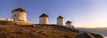 Low angle view of traditional windmills, Mykonos, Cyclades Islands, Greece by Panoramic Images