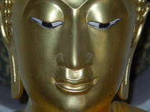 Gold Buddha statue face by James Menges