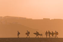 Surfers At Sunset by Alex Bramwell