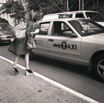 Woman paying taxi: New York City by Ron Greer