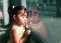 girl's reflection in bus window Mexico City by Charles Harker