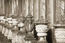 Ornate weathered Italian urns. by John Greim