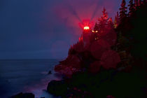 Lighthouse in night storm. von John Greim