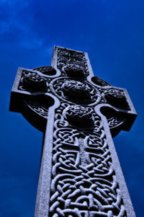 Celtic high cross at dusk. by John Greim