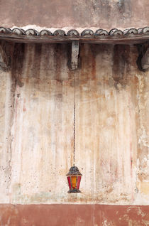Old Lantern Hanging Against Wall by Neil Overy