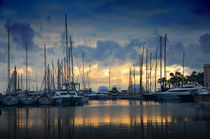The sunset over the marina in Cannes, France  by tkdesign