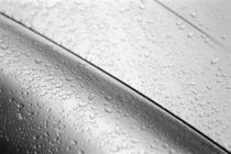 Water drops on silver car von Danita Delimont