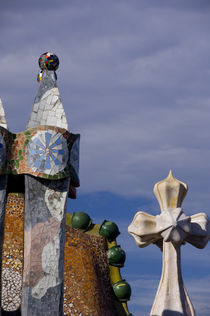 Views of typical Gaudi chimney sturctures covered in colorful broken pottery tiles called trencadis by Danita Delimont