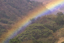 Rainbow over rural valley by Danita Delimont