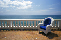 Wicker chair and tiled terrace at the Hornet Dorset Primavera Hotel von Danita Delimont