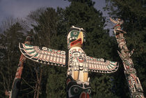 Native American totem poles at Stanley Park by Danita Delimont