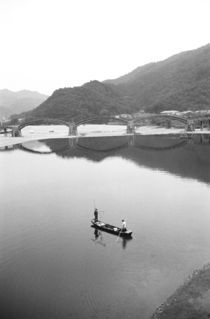 Fishermen and historic bridge by Danita Delimont