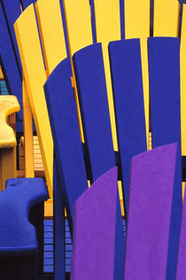 Colorful adirondack chairs by Danita Delimont