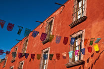 Colorful banners strung across street by Danita Delimont