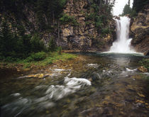 Running Eagle Falls aka Trick Falls in the Two Medicine Valley of Glacier National Park in Montana von Danita Delimont