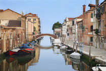 View of boats and homes along one of the many city canals by Danita Delimont