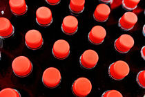 Bottles red caps by Sami Sarkis Photography