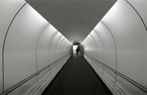 Passenger at end of airport walkway by Sami Sarkis Photography
