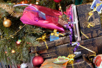 Gift wrapped presents under Christmas tree by Sami Sarkis Photography