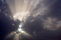 Sun shining through clouds by Sami Sarkis Photography