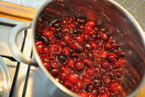Cherries cooking in pan by Sami Sarkis Photography