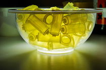 Syringes pump parts in bowl by Sami Sarkis Photography