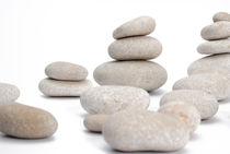 Stacks of smooth pebble stones by Sami Sarkis Photography
