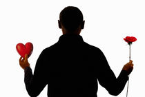 Silhouette of man holding heart and rose von Sami Sarkis Photography