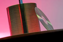 CD leaning against stack of CD's by Sami Sarkis Photography