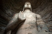Giant Buddha statue carved inside the ancient Yungang Grottoes by Sami Sarkis Photography