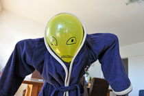 Kid in dad bathrobe hiding face with balloon by Sami Sarkis Photography
