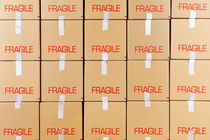 Stacks of cardboard boxes marked 'Fragile' von Sami Sarkis Photography