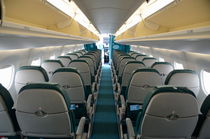 Rows of empty airplane seats by Sami Sarkis Photography