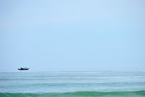 Boat on horizon line by Sami Sarkis Photography