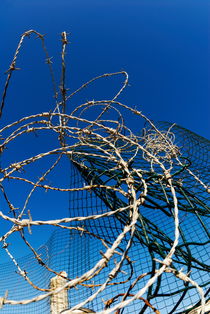 Fence with barbed wires by Sami Sarkis Photography