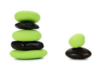 Two stacks of green and black pebbles by alternance by Sami Sarkis Photography