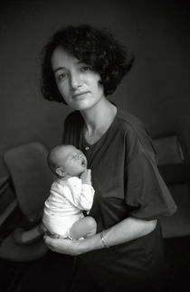 Portrait of mature woman with newborn baby (0-3 months) by Sami Sarkis Photography