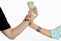 Hand grabbing man's fistful of money by Sami Sarkis Photography