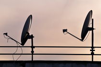 Two Satellite dishes and sunset sky von Sami Sarkis Photography