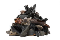 Heap of used shoes by Sami Sarkis Photography