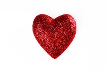 Glittery heart on white background by Sami Sarkis Photography