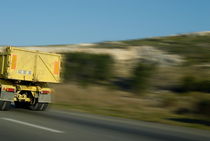 Truck speeding on highway by Sami Sarkis Photography